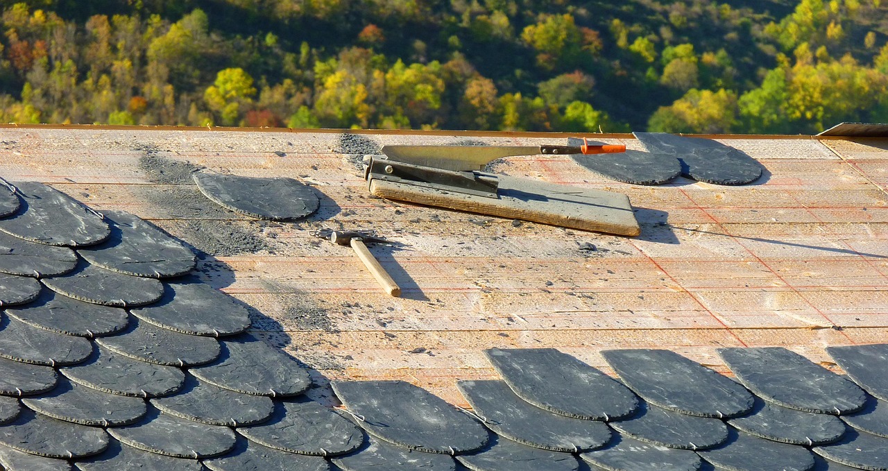 roofer fastening standing seam metal roof